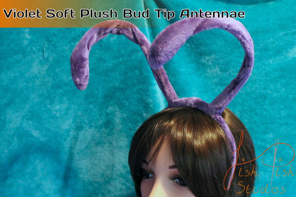 A pair of lilac coloured headband antennae for costumes and cosplay. There is a wire core for posing, they are fixed to a plastic headband. Fits most sized heads. For fursuits, larp and therian costumes