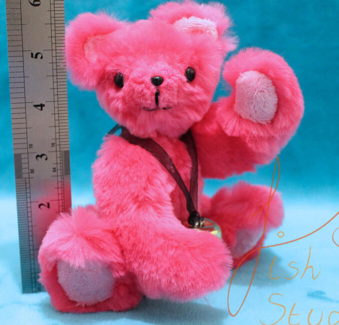 A cute, jointed pink teddy sporting a bell necklace. This cutie is big enough to hug but small enough to travel. Made with luxury faux fur and minky fabrics. handmade in the UK by fishpish studios