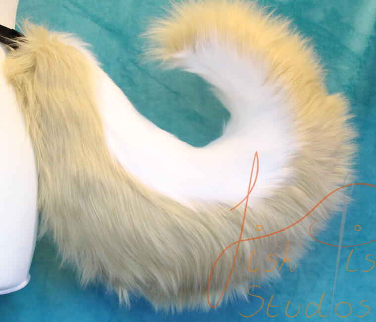 A beautifully bouncy and curvy tail, these can be bought in a variety of colour combinations. This one is white and latte, handmade in the UK by fishpish Studios