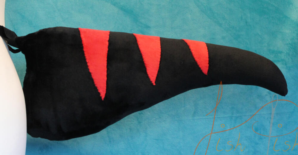 Inspired by the velociraptors in jurassic park, this striped raptor tail is one of the original designs made by fishpish studios. Made with soft plush (minky) fabric, the stripes are hand sewn on. Available in store