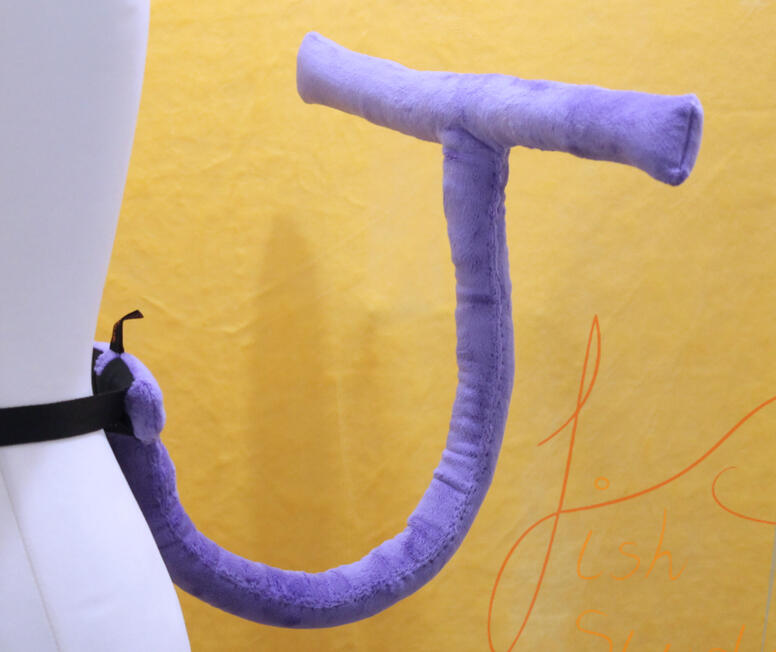 A one off jevil tail made for a cosplay commission. it has a wire core, wrapped with wadding and covered in soft plush fabric. it is posable, and is attached to a belt with belt loops. handmade by fishpish studios