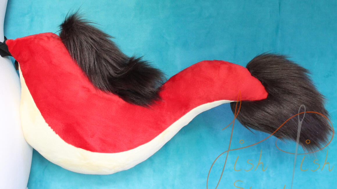 A slightly altered eastern dragon tail pattern to include a belly stripe. Made of minky and faux fur, this was commissioned by a client on etsy. handmade by fishpish studios