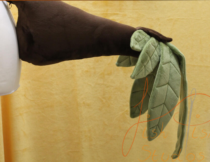 Custom made pot leaf raptor tail consisting of seven leaves and a base brown tail. Made of minky fabric, the leaves hang like natural pot leaves at the end of the tail's tip. designed by the commissioner and made by fishpish studios