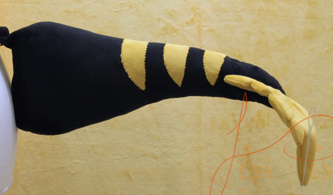 A slightly more complex striped raptor tail with a feathered tip. designed by the commissioner and made by fishpish studios, these tails are great for cosplay and therian play