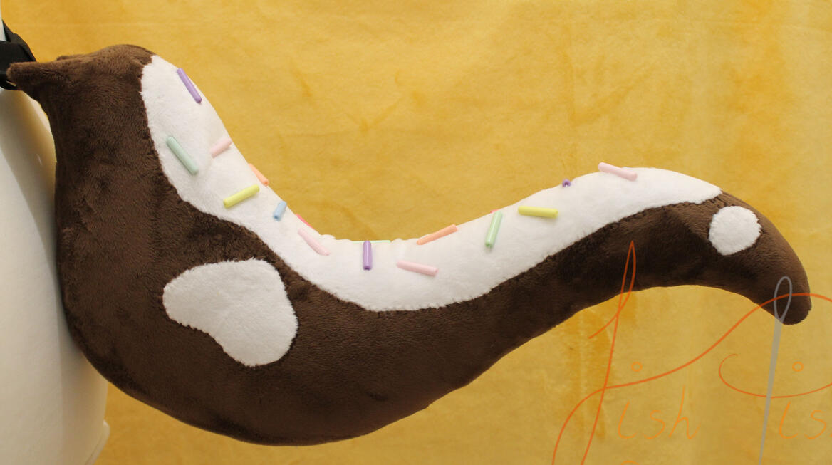 OOAK Cake Tail A one of a kind, cake tail with sprinkles. now sold, this item is made of soft plush/minky fabric and plastic bead like sprinkles. It sits about 21 inches long and is asymetrical. handmade and designed by fishpish studios