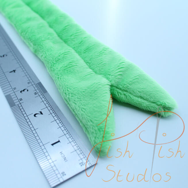 Forked Fursuit Tongue A close up image of a fursuit tongue made by fishpish studios. this tongue is about 5 inches long in the forked style. its made with soft plush fabric and is ideal for fursuit heads