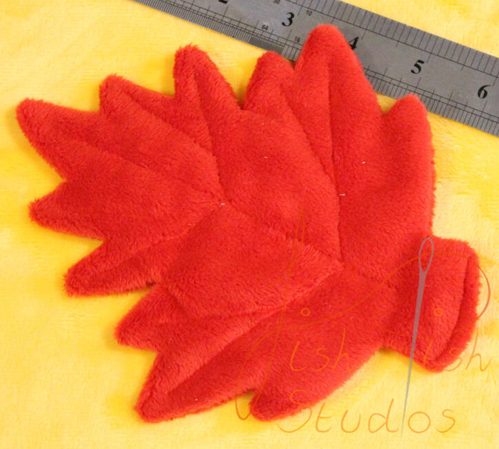 Maple Prop Leaf A close up shot of a custom plush leaf prop for cosplays, plushies and fursuits. Made of soft plush fabric, this drapes beautifully over an item. Available in a varity of colours from fishpish studios