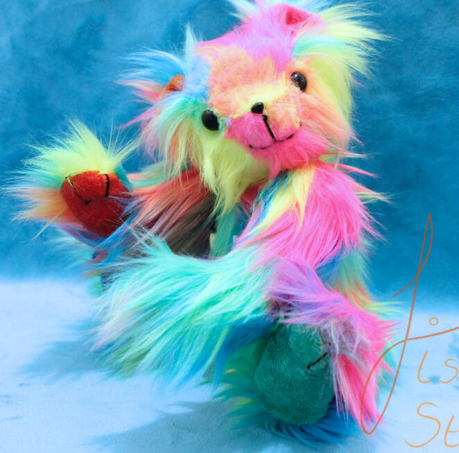 Rainbow Teddy A cute, jointed rainbow teddy sporting a star necklace. This cutie is big enough to hug but small enough to travel. Made with luxury faux fur and minky fabrics. handmade in the UK by fishpish studios